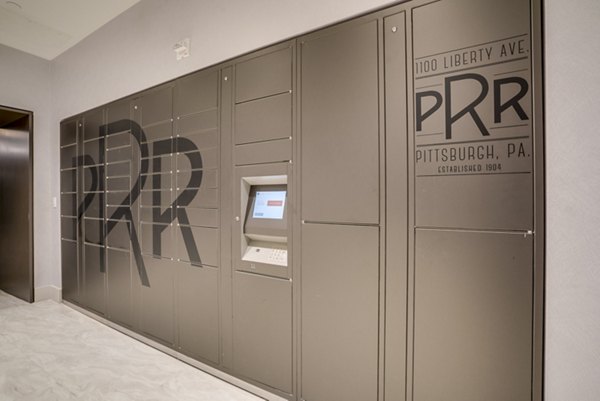 Mail room with organized parcel lockers in The Pennsylvanian Apartments