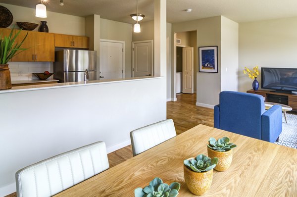 Elegant dining room with modern furnishings at North Bethany Ridge Apartments, perfect for hosting dinners in a luxurious setting