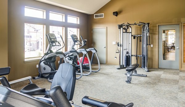 Modern fitness center with state-of-the-art equipment at North Bethany Ridge Apartments