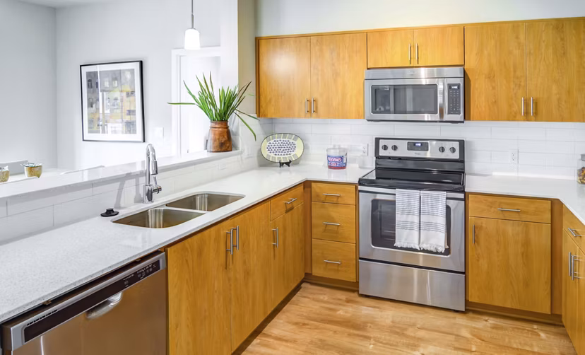 Kitchen with modern appliances and sleek countertops at North Bethany Ridge Apartments
