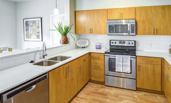 Kitchen with modern appliances and sleek countertops at North Bethany Ridge Apartments