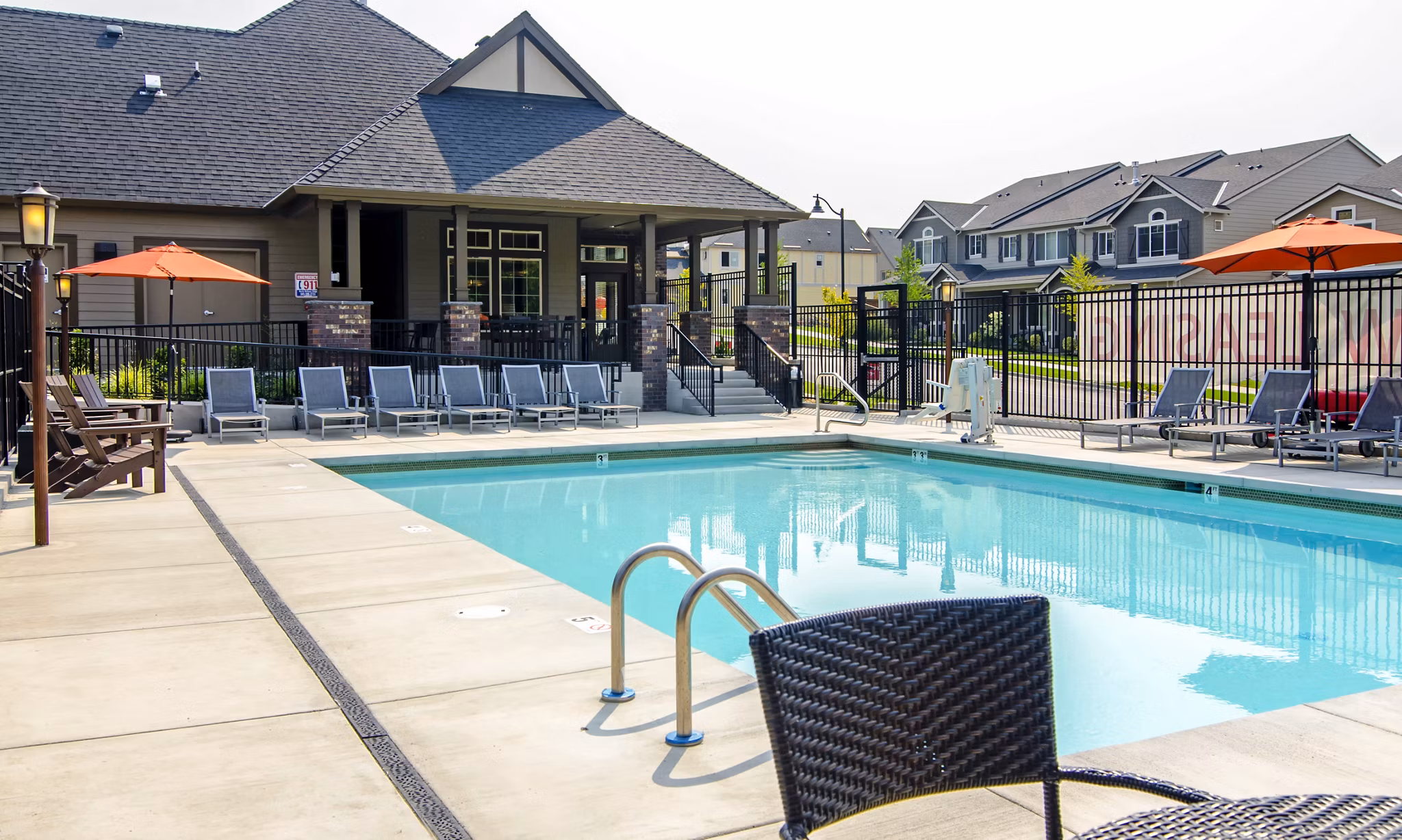 Inviting pool area at North Bethany Ridge Apartments with luxurious seating and scenic views