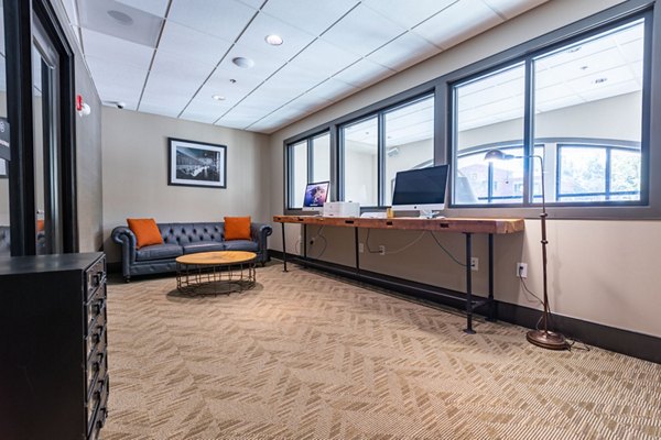 Professional business center with sleek design at The Gramercy Apartments, ideal for luxury living and productivity