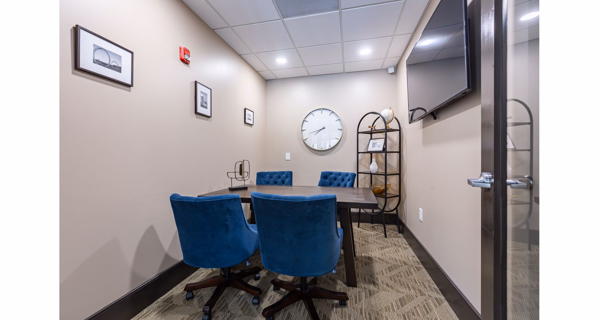 Elegant meeting facility with modern seating and large windows at The Gramercy Apartments