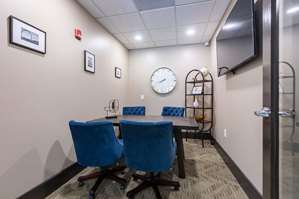 Elegant meeting facility with modern seating and large windows at The Gramercy Apartments