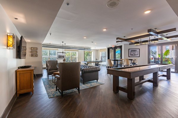 Luxurious clubhouse with modern furnishings at The Gramercy Apartments, ideal for gatherings and relaxation
