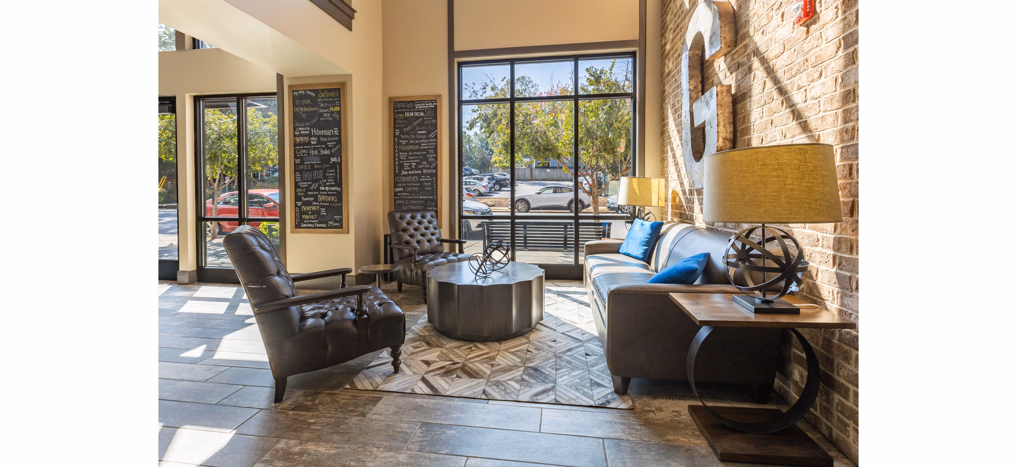 Stylish clubhouse with modern decor at The Gramercy Apartments, offering luxury amenities for residents
