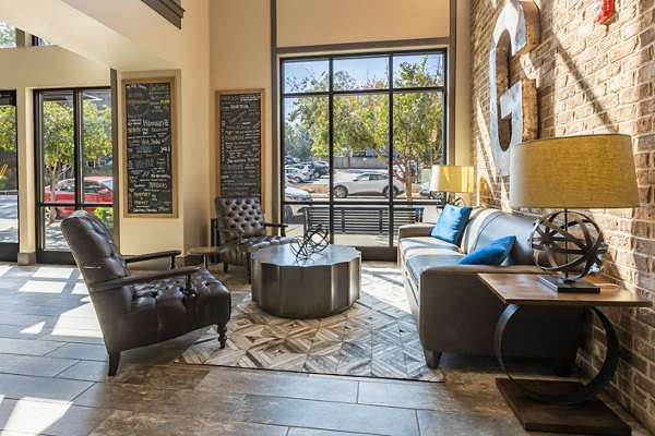Stylish clubhouse with modern decor at The Gramercy Apartments, offering luxury amenities for residents
