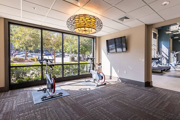 Modern yoga and spin studio with sleek design at The Gramercy Apartments, luxury property by Greystar