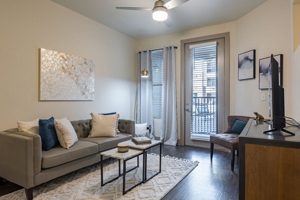 Spacious living room with modern decor in The Gramercy Apartments