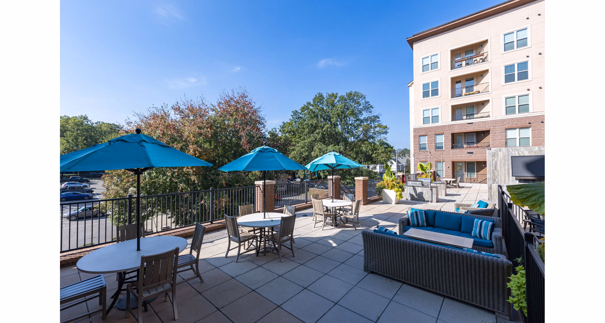 Outdoor patio with modern seating at The Gramercy Apartments offering luxury living spaces