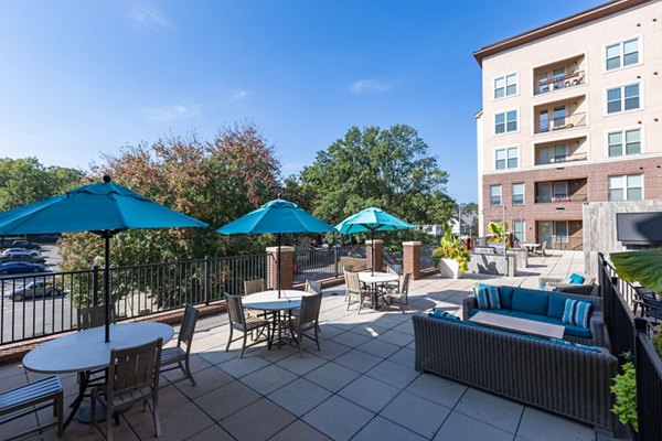 Outdoor patio with modern seating at The Gramercy Apartments offering luxury living spaces