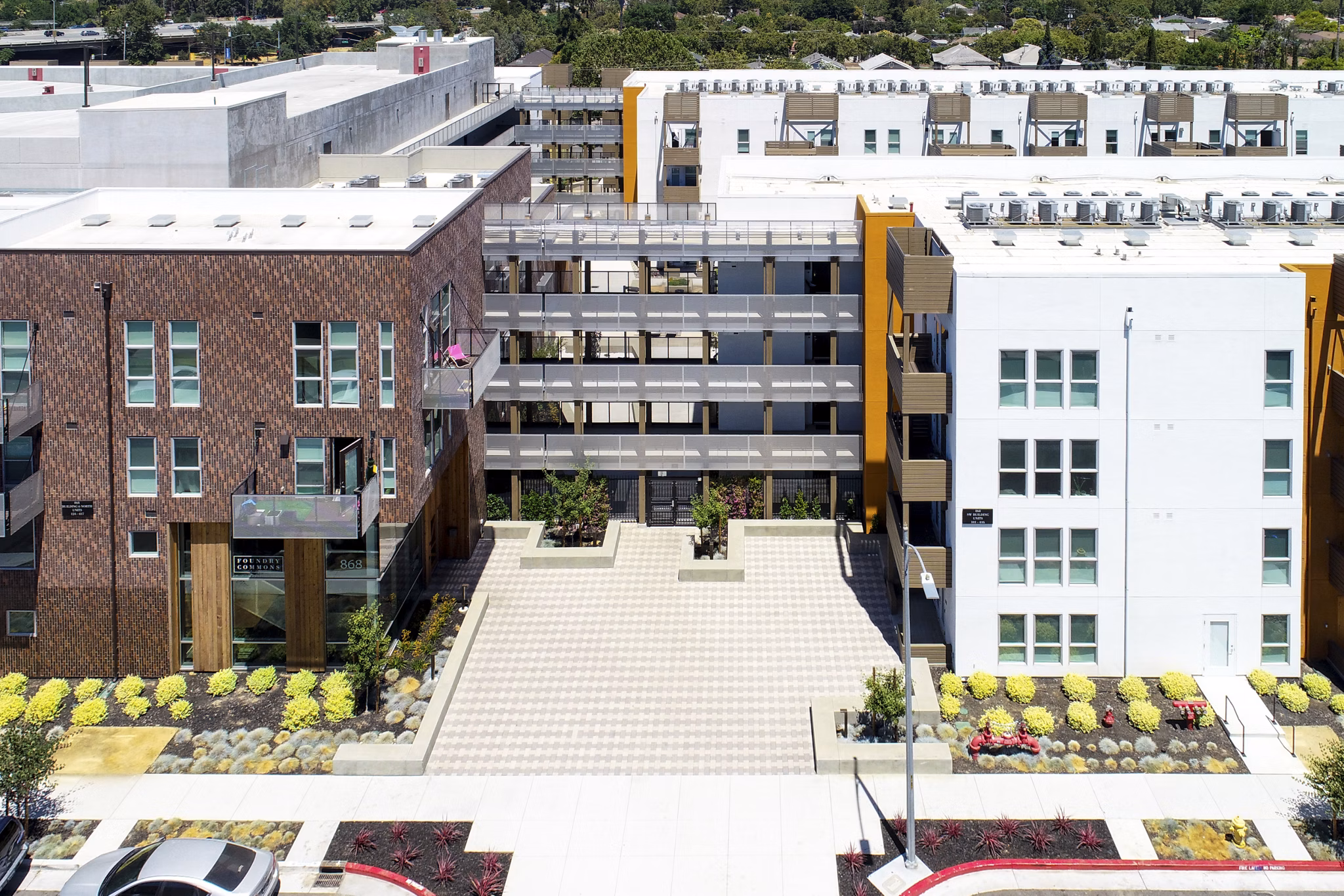 Greystar luxury apartments: Modern apartment complex with landscaped areas and central courtyard