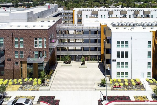 Greystar luxury apartments: Modern apartment complex with landscaped areas and central courtyard