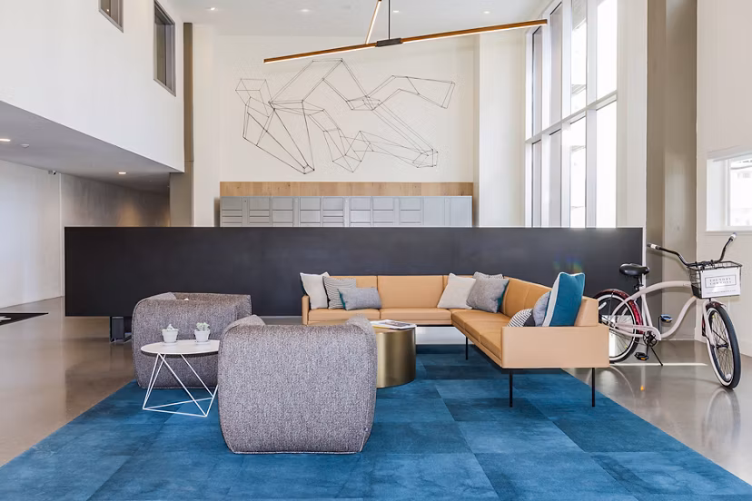 Clubhouse featuring modern interiors and communal seating at Foundry Commons Apartments