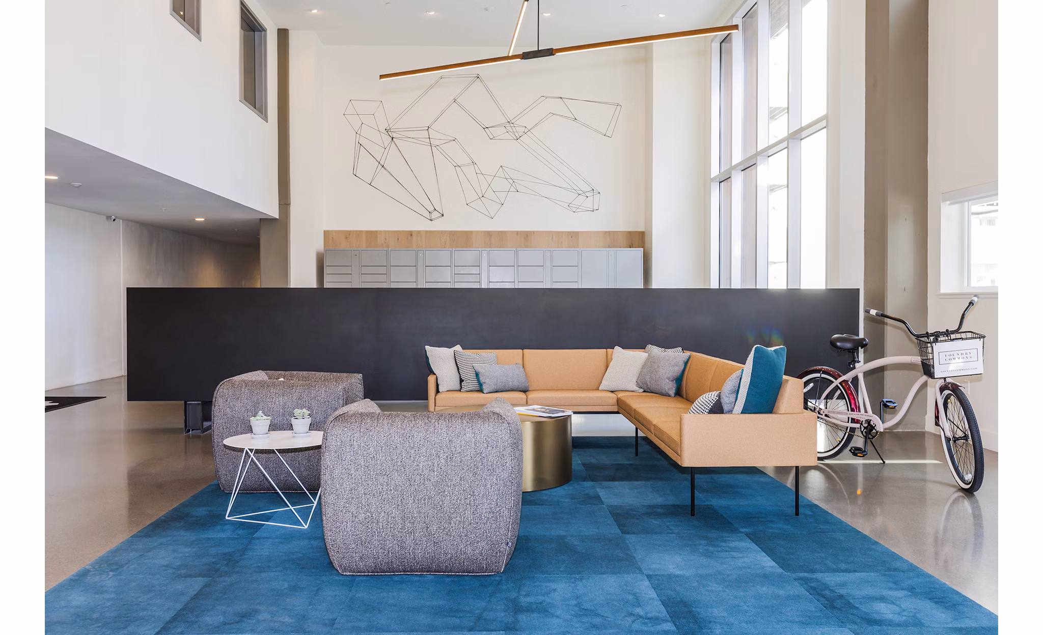 Clubhouse featuring modern interiors and communal seating at Foundry Commons Apartments