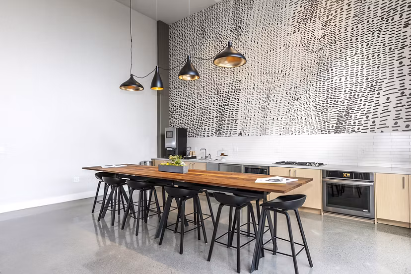 Clubhouse featuring modern design and comfortable seating at Foundry Commons Apartments
