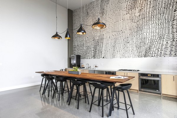 Clubhouse featuring modern design and comfortable seating at Foundry Commons Apartments