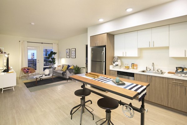 Modern kitchen with stainless steel appliances at Foundry Commons Apartments in California
