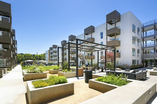 Courtyard at Foundry Commons: Modern outdoor space with lush greenery and seating areas for relaxation and social gatherings in Santa Fe