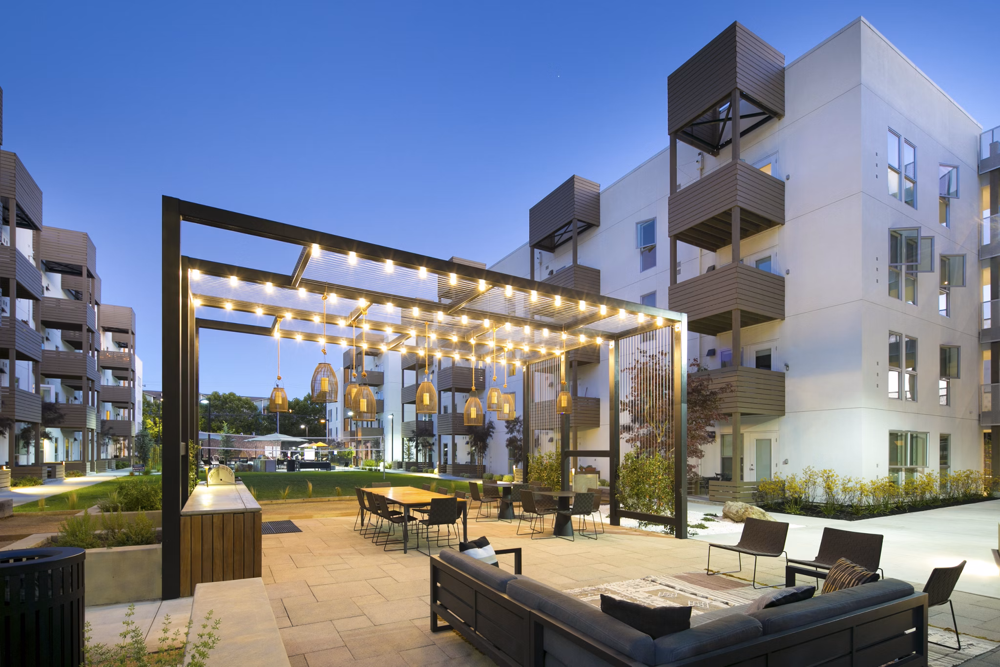 Grill area with picnic tables at Foundry Commons Apartments, perfect for outdoor dining and gatherings