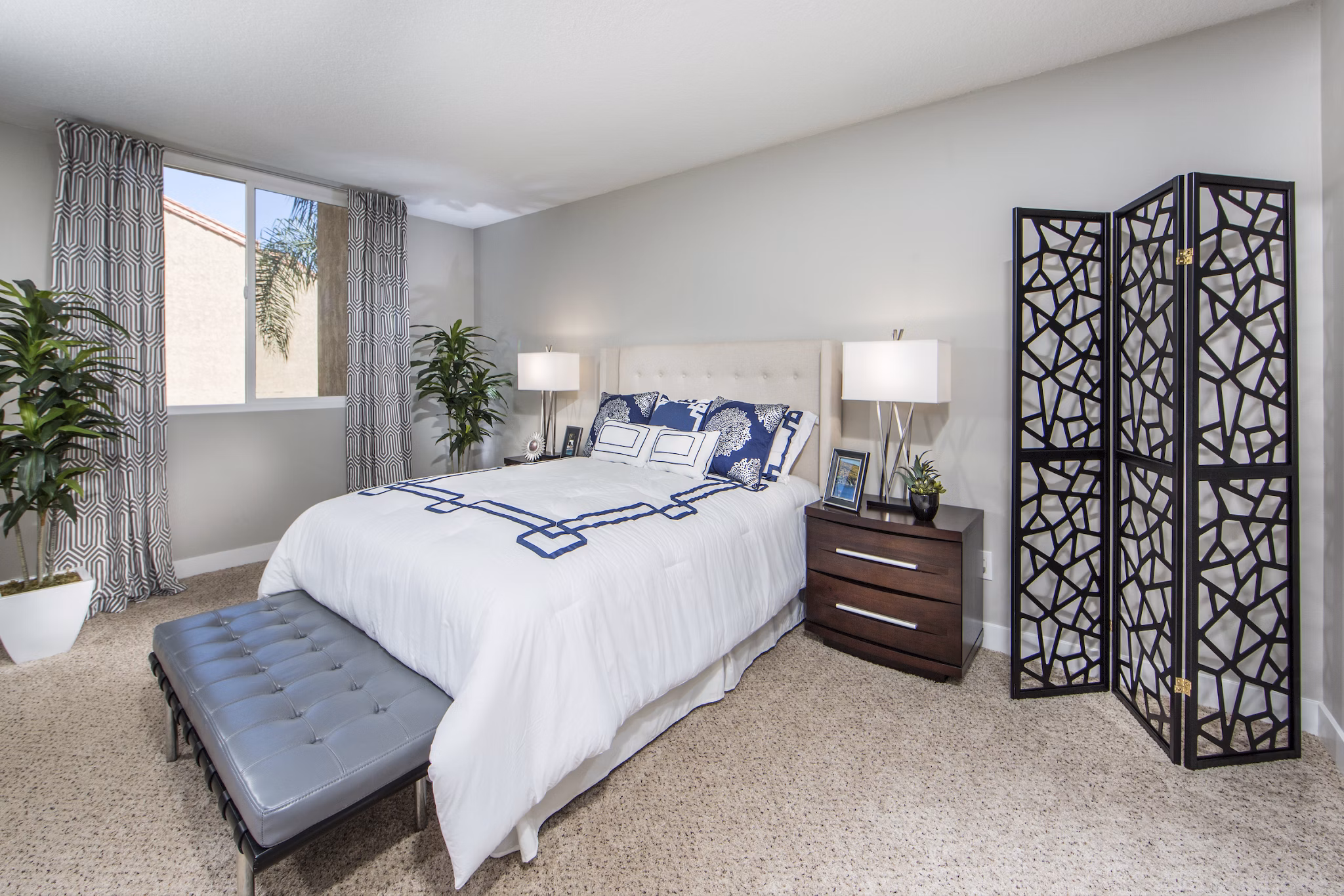 Cozy bedroom with ocean view at Avana Rancho Palos Verdes Apartments, featuring contemporary design and ample natural light