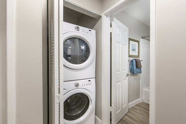 Laundry room with modern appliances at Avana Rancho Palos Verdes Apartments, luxury living space in picturesque Southern California