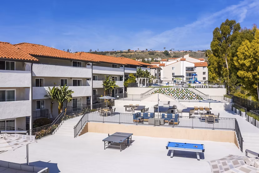 Outdoor recreational area with BBQ and seating at Avana Rancho Palos Verdes Apartments