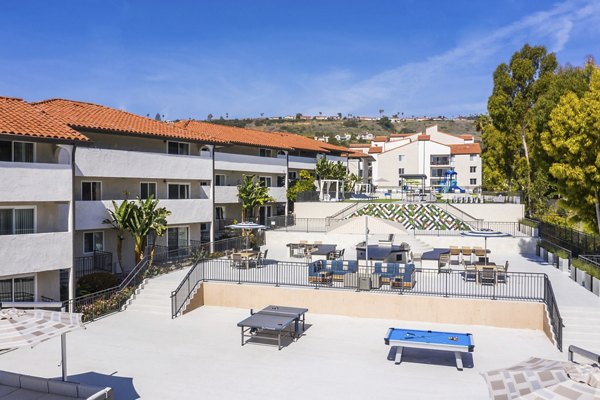 Outdoor recreational area with BBQ and seating at Avana Rancho Palos Verdes Apartments