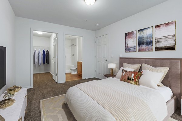 Cozy bedroom with modern decor at Carrington Place Apartments
