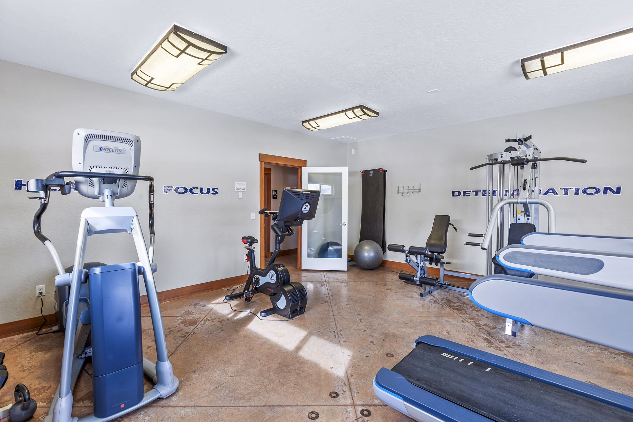 State-of-the-art fitness center with modern equipment at Carrington Place Apartments Stay active and healthy in a luxurious environment