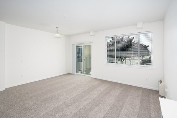 Cozy bedroom featuring modern decor and natural light at Villas at Tullamore Apartments
