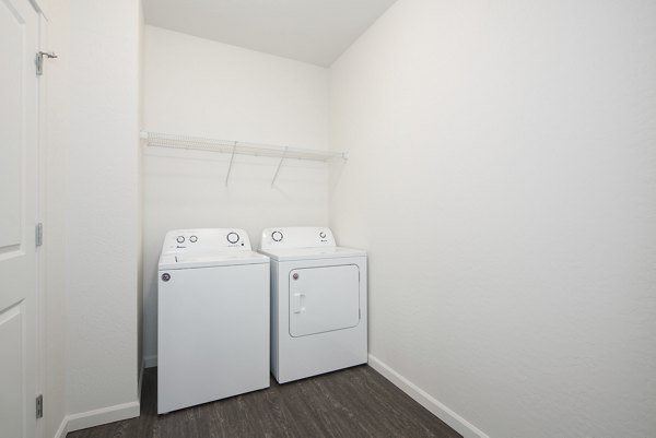 Laundry room equipped with modern appliances at Villas at Tullamore Apartments