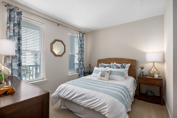 Elegant bedroom with scenic views at Bridgeside at Patriots Point Apartments