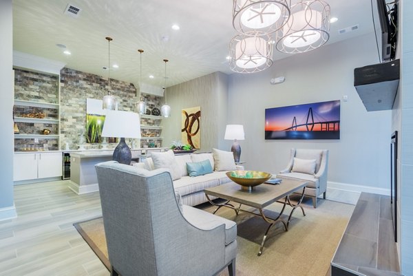 Clubhouse with modern decor and seating at Bridgeside at Patriots Point Apartments