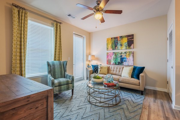 Spacious living room with modern decor in Bridgeside at Patriots Point Apartments