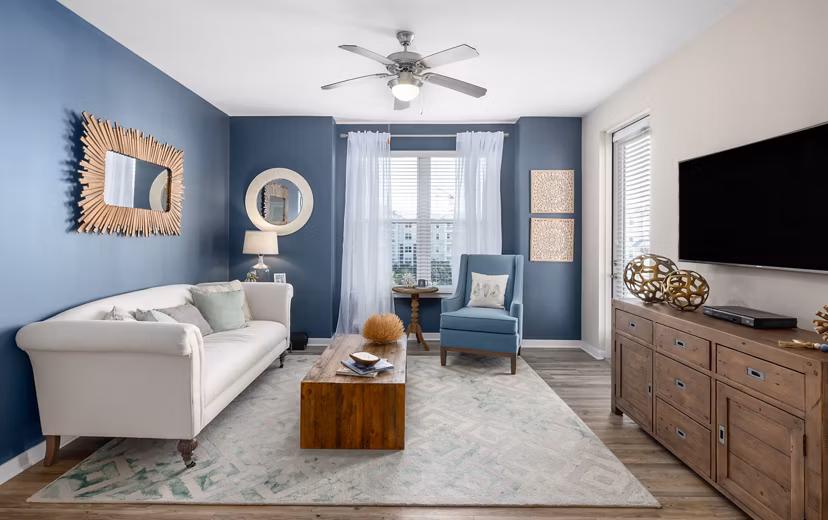 Inviting living room with modern decor and natural light at Bridgeside at Patriots Point Apartments