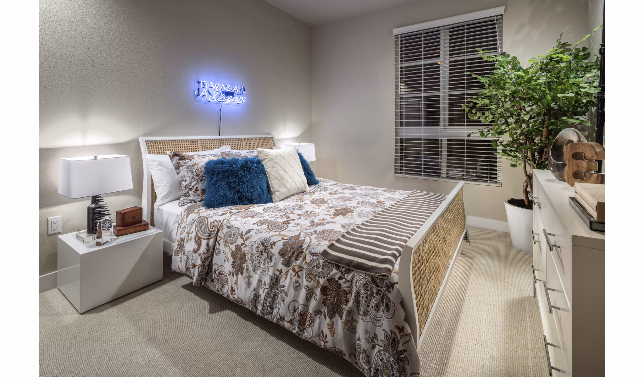 Bedroom with modern decor and large windows at Luxe Pasadena Apartments, offering luxury living in the heart of Pasadena