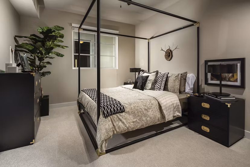 Modern bedroom with large windows and sleek design at Luxe Pasadena Apartments