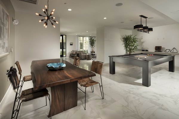 Game room featuring a pool table and lounge area at Luxe Pasadena Apartments