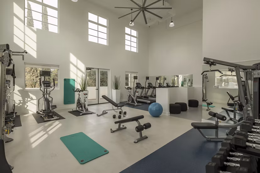 Modern fitness center with state-of-the-art equipment at Luxe Pasadena Apartments