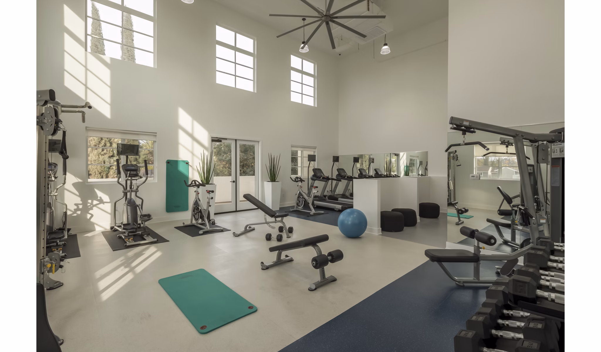 Modern fitness center with state-of-the-art equipment at Luxe Pasadena Apartments
