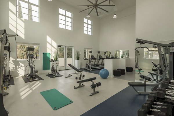 Modern fitness center with state-of-the-art equipment at Luxe Pasadena Apartments