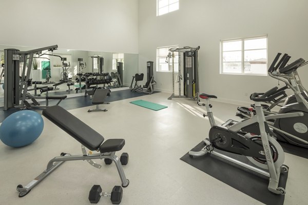 State-of-the-art fitness center with modern equipment at Luxe Pasadena Apartments
