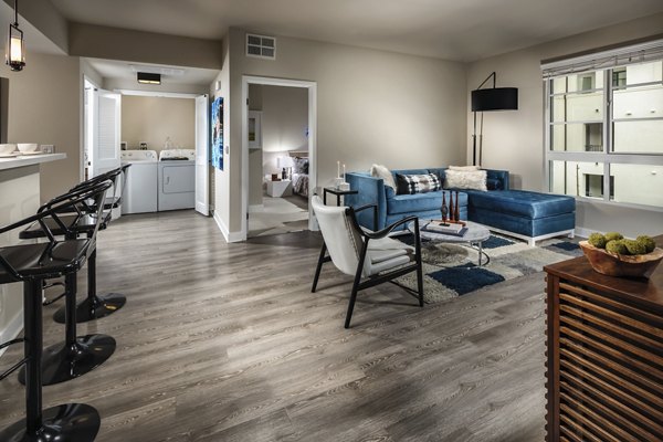Spacious living room with modern decor at Luxe Pasadena Apartments