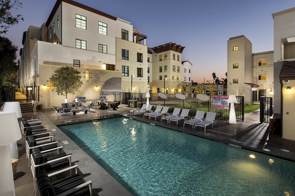 Chic pool area with lounge seating at Luxe Pasadena Apartments, offering a luxurious retreat in the heart of Pasadena