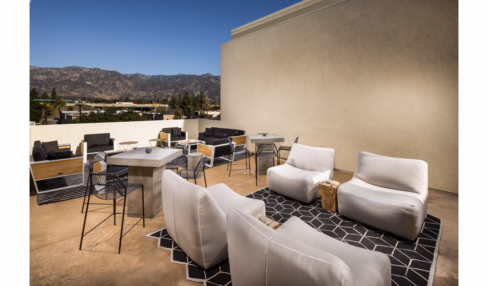 Stylish rooftop deck with seating and skyline views at Luxe Pasadena Apartments, luxury living in the heart of Pasadena