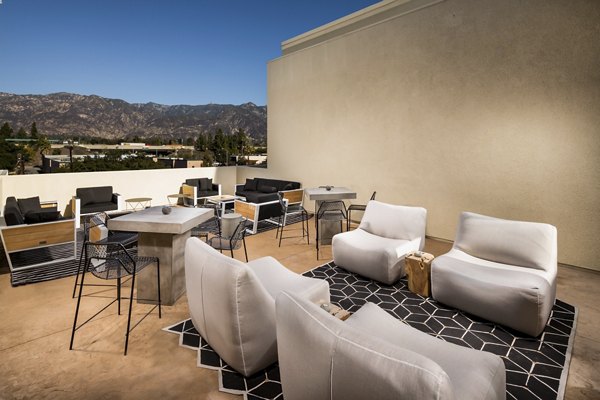 Stylish rooftop deck with seating and skyline views at Luxe Pasadena Apartments, luxury living in the heart of Pasadena