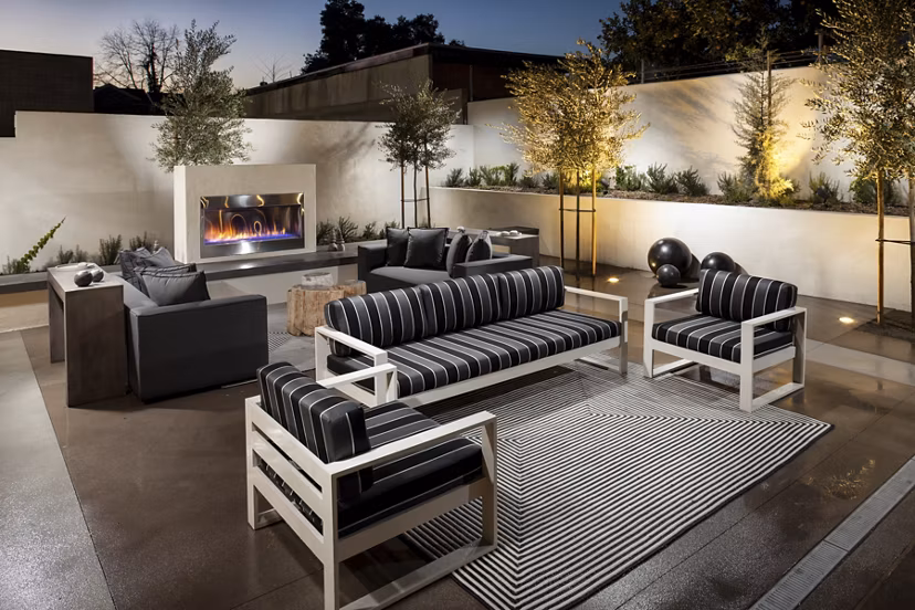 Courtyard with lush gardens and seating areas at Luxe Pasadena Apartments