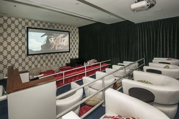 Theater featuring comfortable seating at The Ave at Norman Apartments